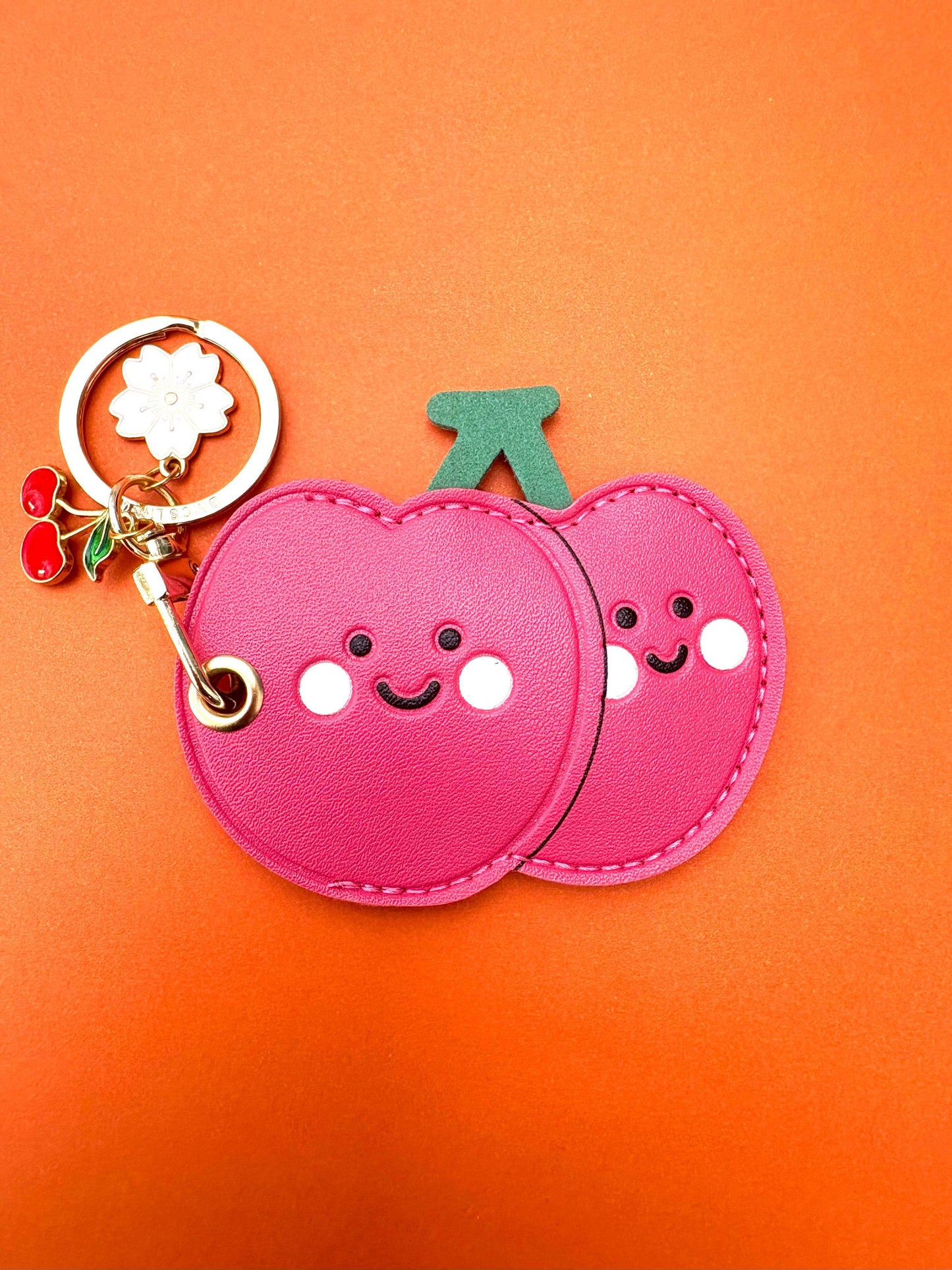 Cherry Pink Vegan Leather AirTag Holder Keychain — Stylish AirTag Case with Tassel Charm - PACK OF JOY