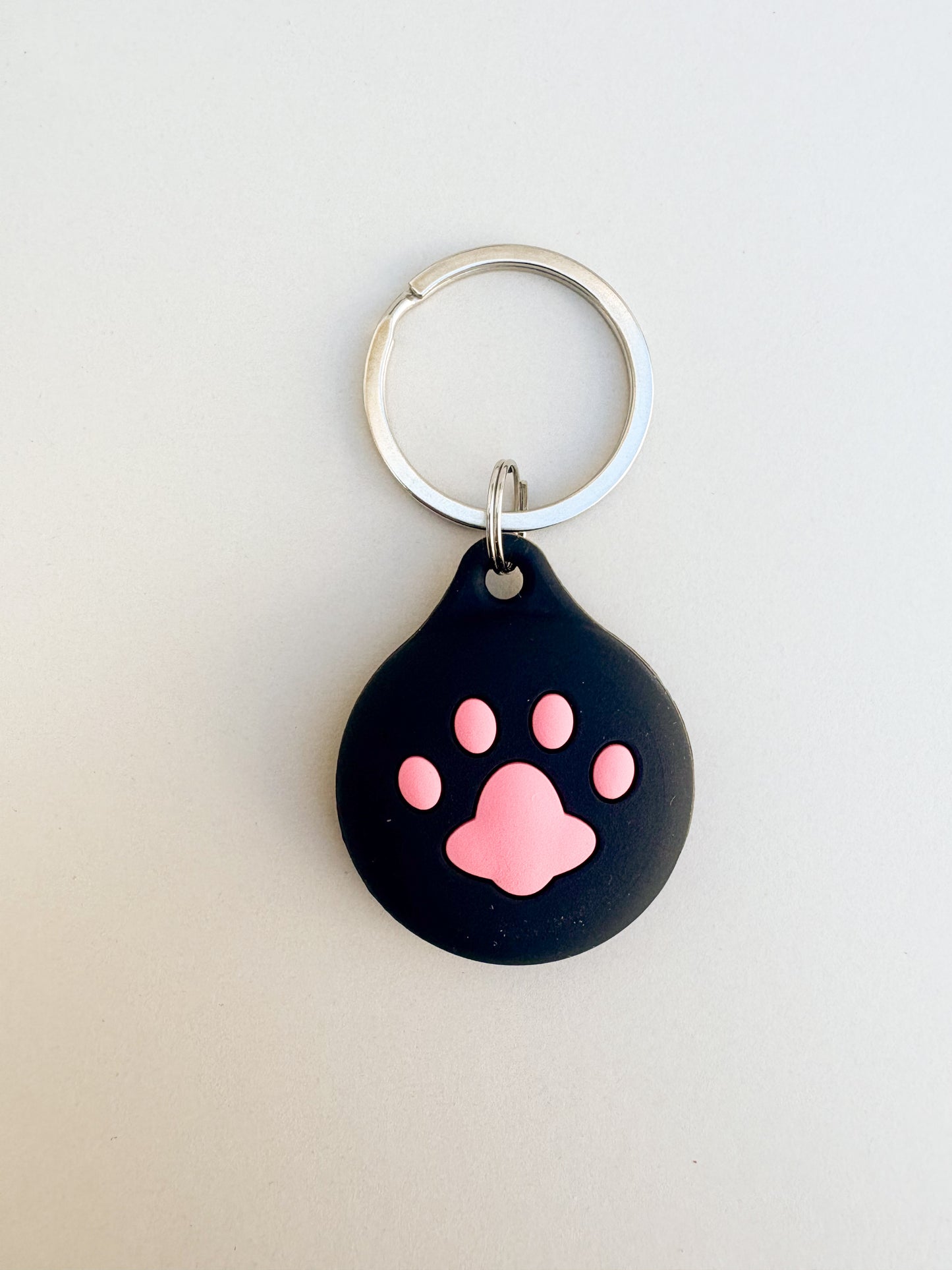 Cute Black Paw Silicone AirTag Cover Keychain — Fun AirTag Holder for Kids’ Backpack or Shoes